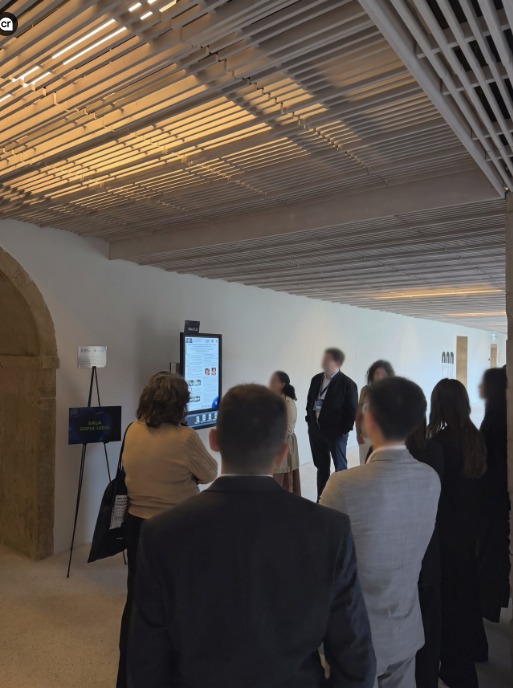 Attendees beside an ePosters screen at Convento de São Francisco, Coimbra